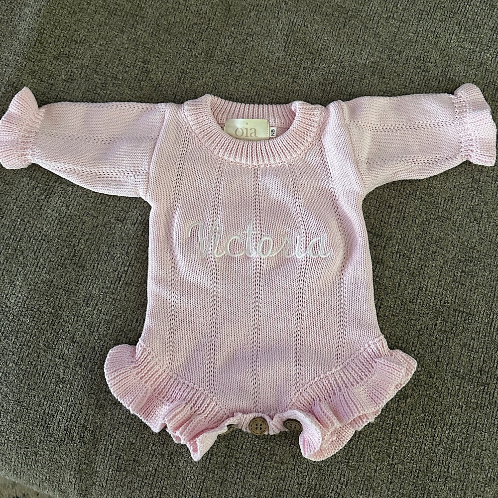 Embroidered and personalized newborn knitted onesie for coming home outfit